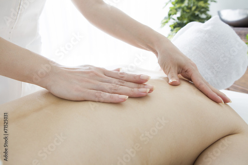 Aroma oil massage of the back of the female