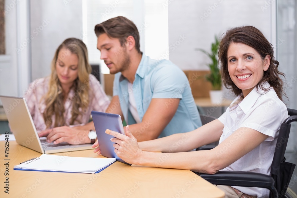 Business people using digital tablet and laptop in meeting Business people using digital tablet and laptop in meeting