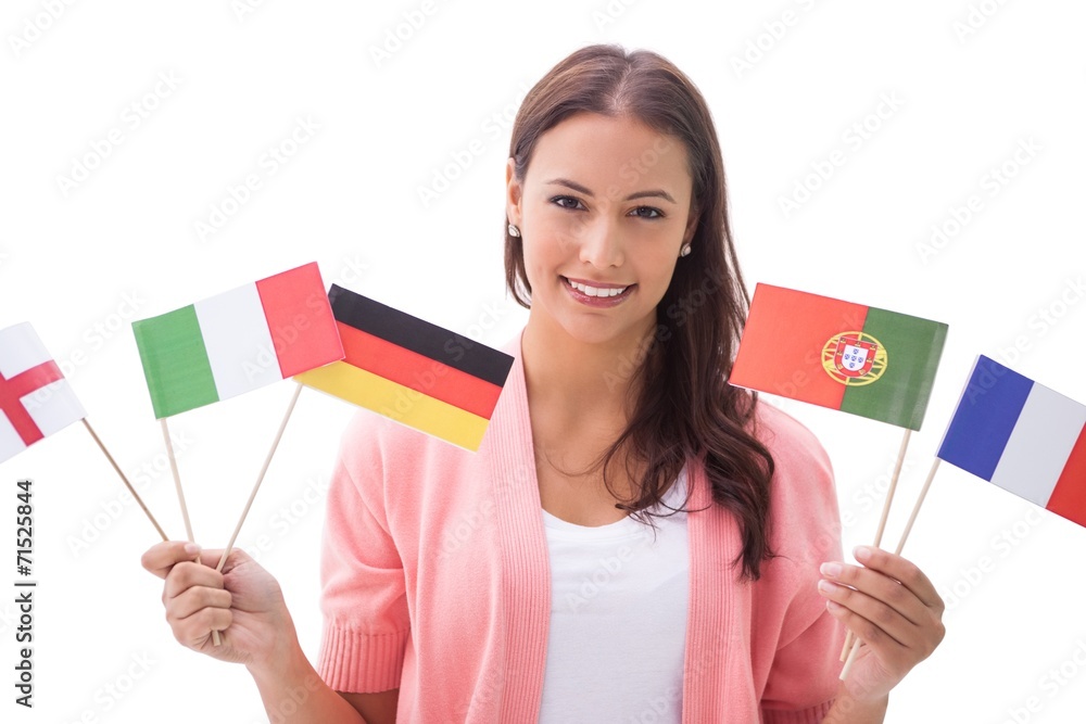 Pretty brunette smiling and holding flags Pretty brunette smiling and holding flags