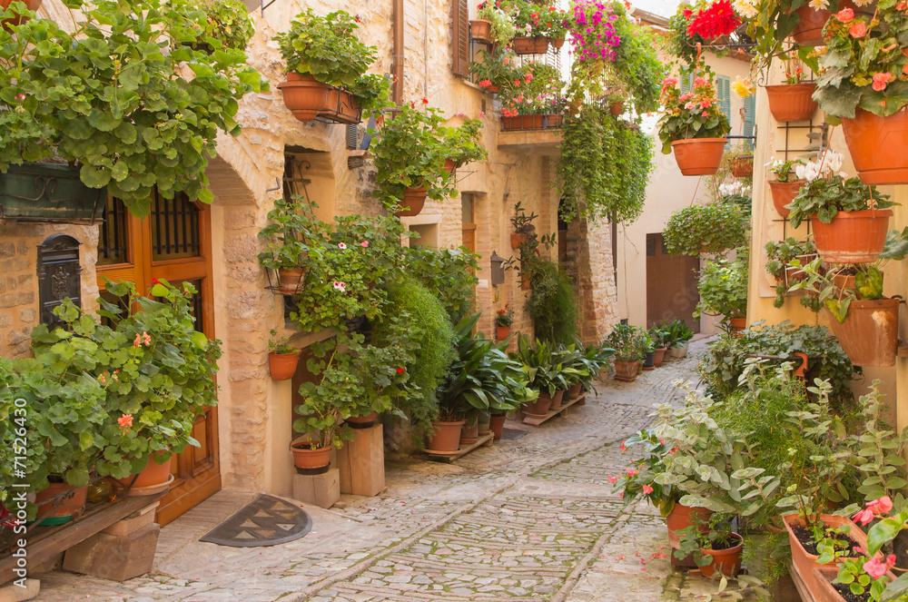 Flower street in the town of Spello (Umbria, Italy)