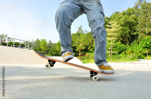 woman skateboarder skateboarding at skatepark © lzf