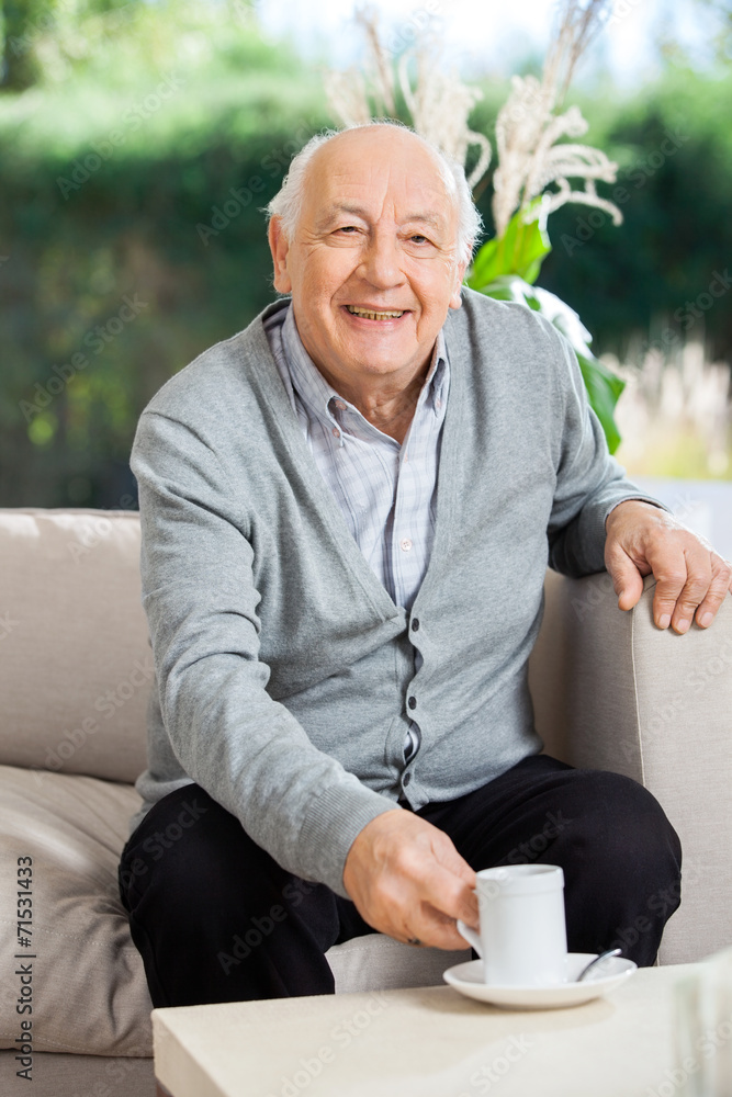 Happy Senior Man Having Coffee At Nursing Home Porch Happy Senior Man Having Coffee At Nursing Home Porch