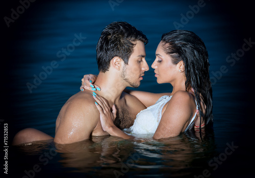 Passionate young couple in water