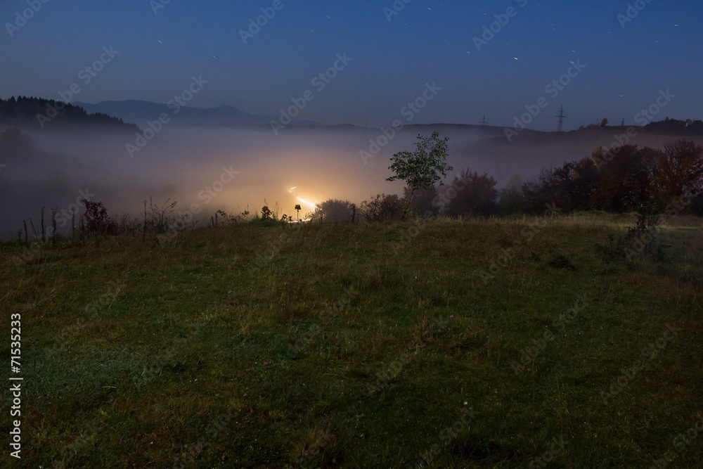 cold fog before sunrise in mountains