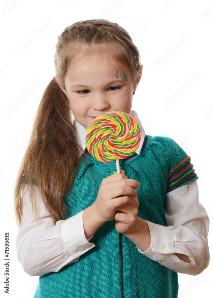 Little girl with lollipop isolated on white background