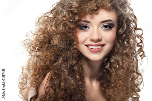 Принти на полотні Young beautiful woman with long curly hairs