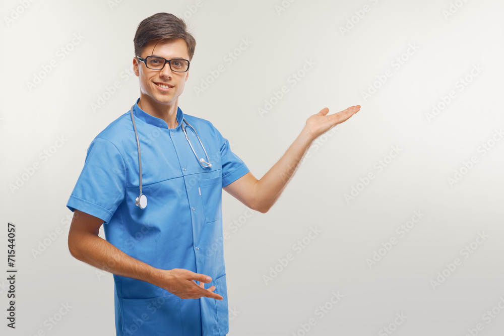 Doctor showing a copy space against white background. Doctor showing a copy space against white background.