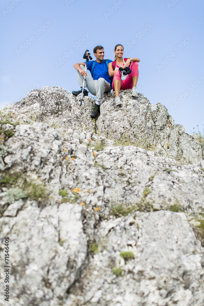 Young couple hiking on the mountain