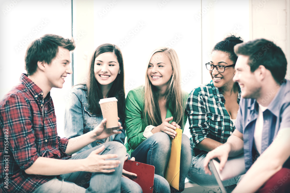 students communicating and laughing at school