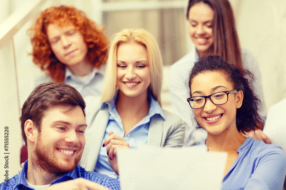 Fototapeta premium team with papers and take away coffee on staircase