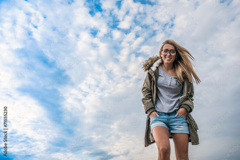 Girl on the sky background at autumn time Girl on the sky background at autumn time