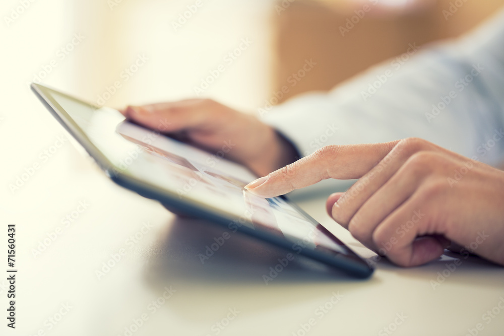 Woman using digital tablet indoor Woman using digital tablet indoor
