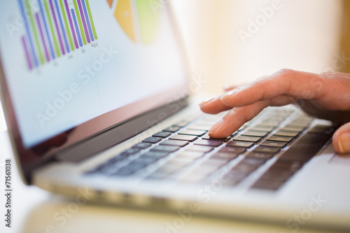 Woman working on financial data with screen computer