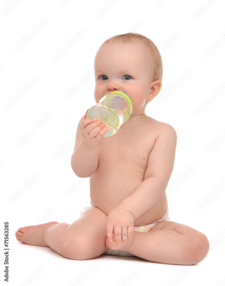 Infant child baby toddler sitting and drinking water Infant child baby toddler sitting and drinking water