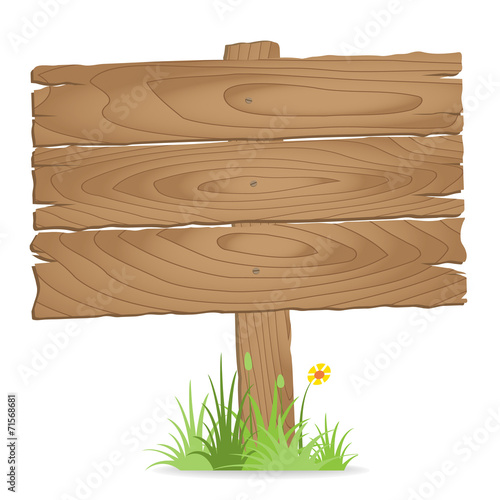 Wooden signpost on  grass with flower