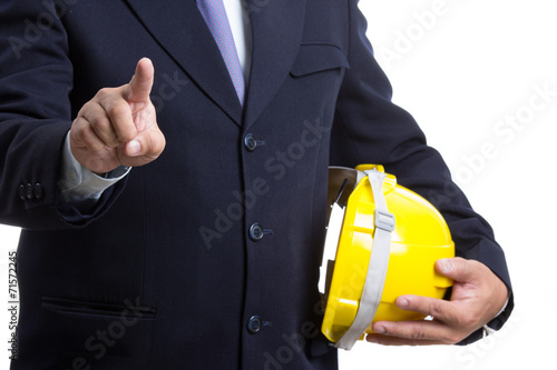 Engineer holding safety hat and touching something