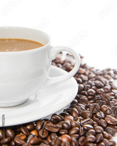 Coffee cup and beans on a white background.