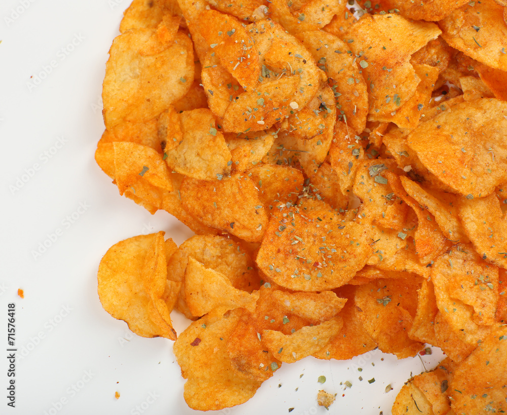 Homemade potato chips isolated on white Homemade potato chips isolated on white