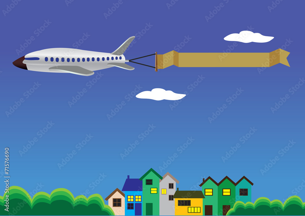 Airplane with banner flying above Houses