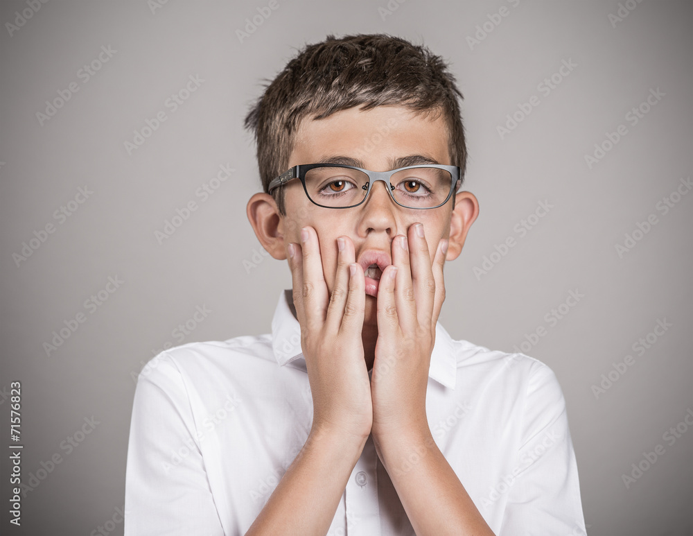 Portrait overwhelmed teenager boy worried grey background Portrait overwhelmed teenager boy worried grey background