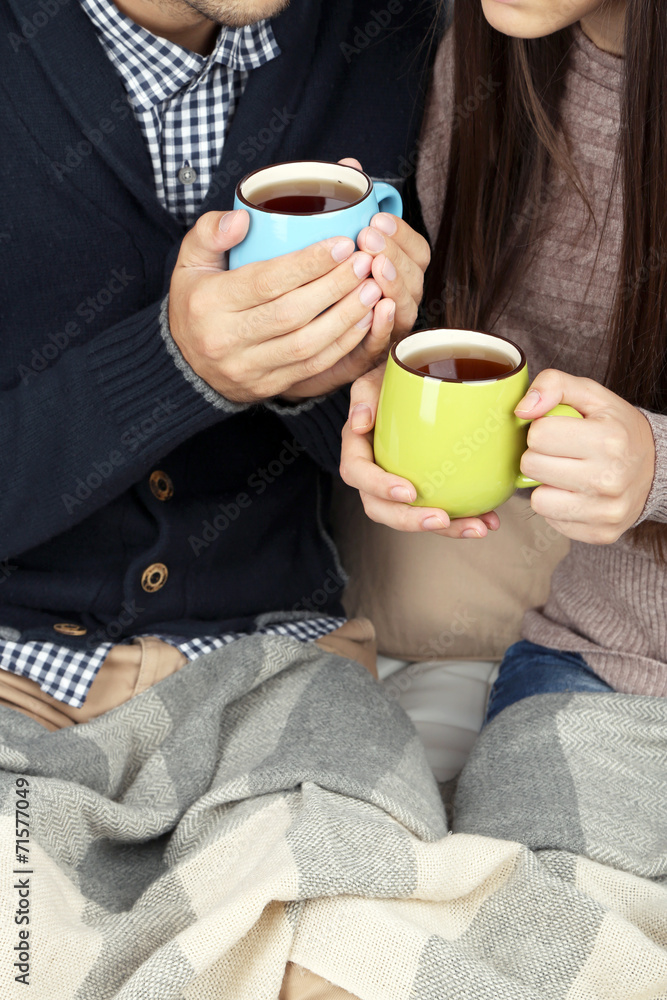 Loving couple with hot drinks Loving couple with hot drinks