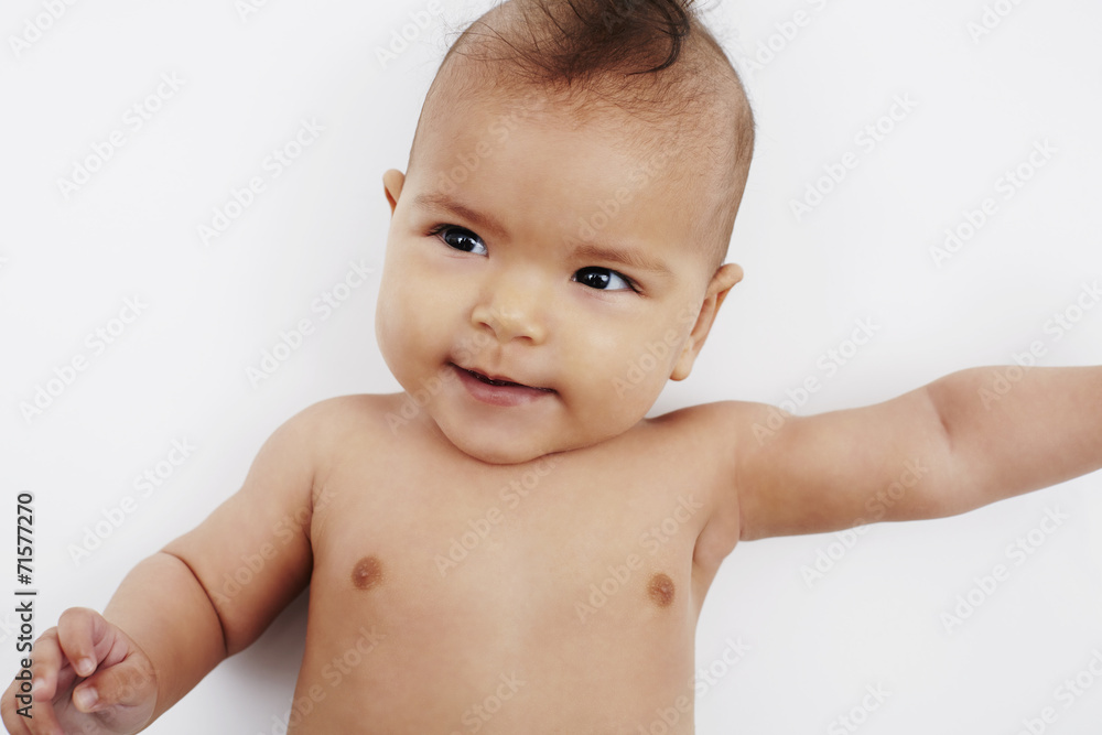 Cheeky six month old baby girl with Mohican hairstyle Cheeky six month old baby girl with Mohican hairstyle