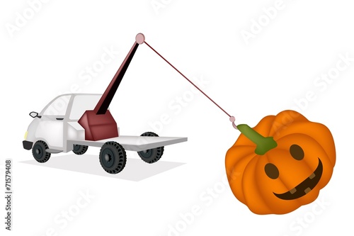 Wrecker Tow Truck Pulling A Jack-o-Lantern Pumpkins