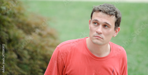  young man relaxing in a park