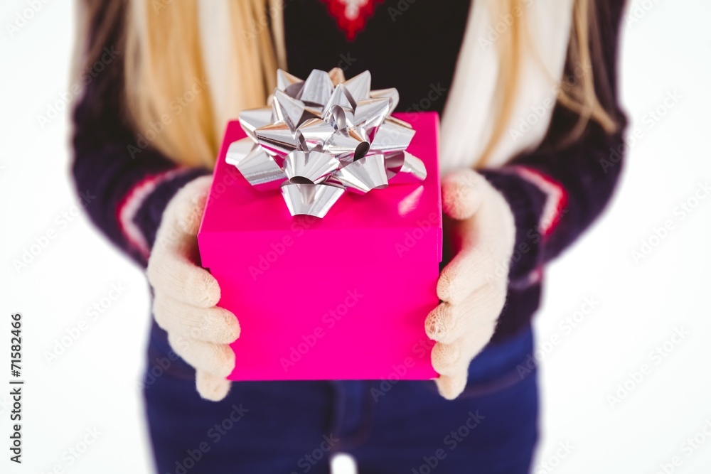 Festive blonde holding a gift Festive blonde holding a gift