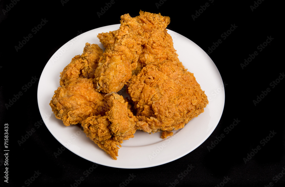Fried Chicken on White Plate and Black Background Fried Chicken on White Plate and Black Background
