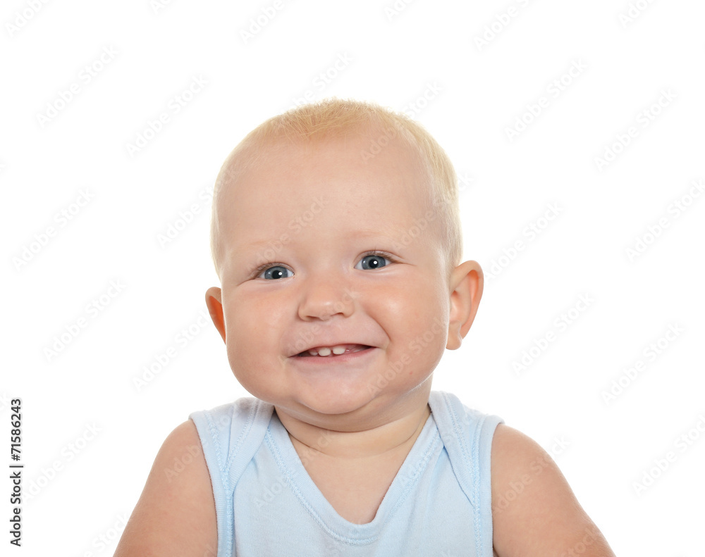 Cute blond baby boy looking away