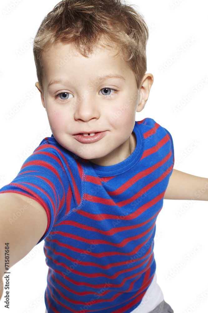 Young boy reaching in studio, close up Young boy reaching in studio, close up