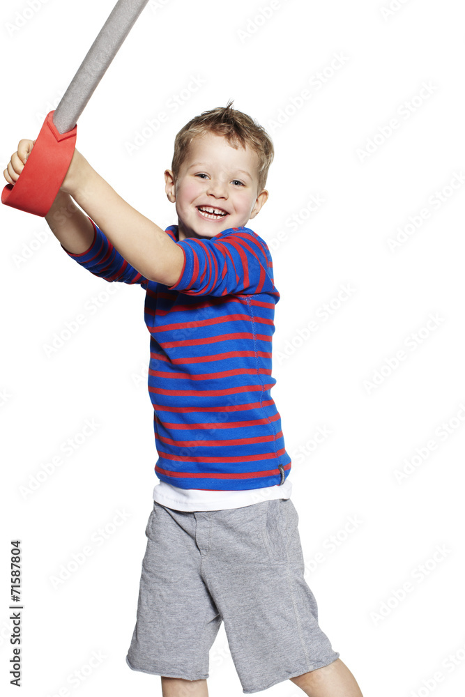 Portrait of young boy playing with toy sword Portrait of young boy playing with toy sword
