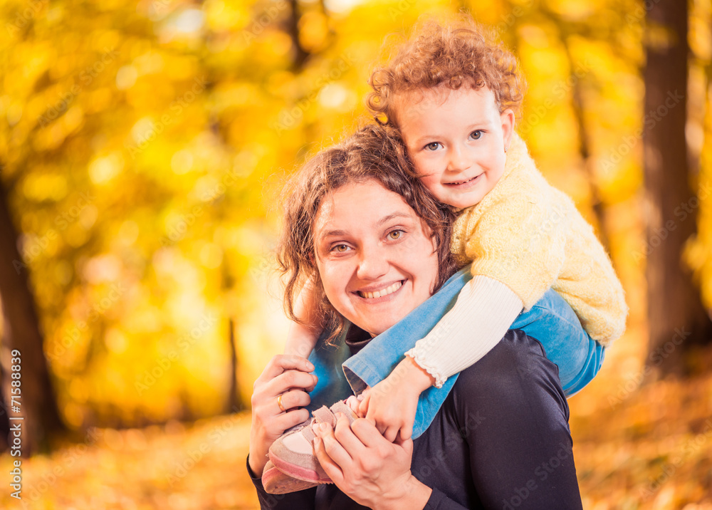 Fototapeta premium happy mother and daugther at fall forest