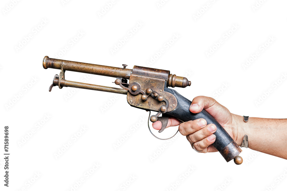 Isolated old vintage gun in male hand