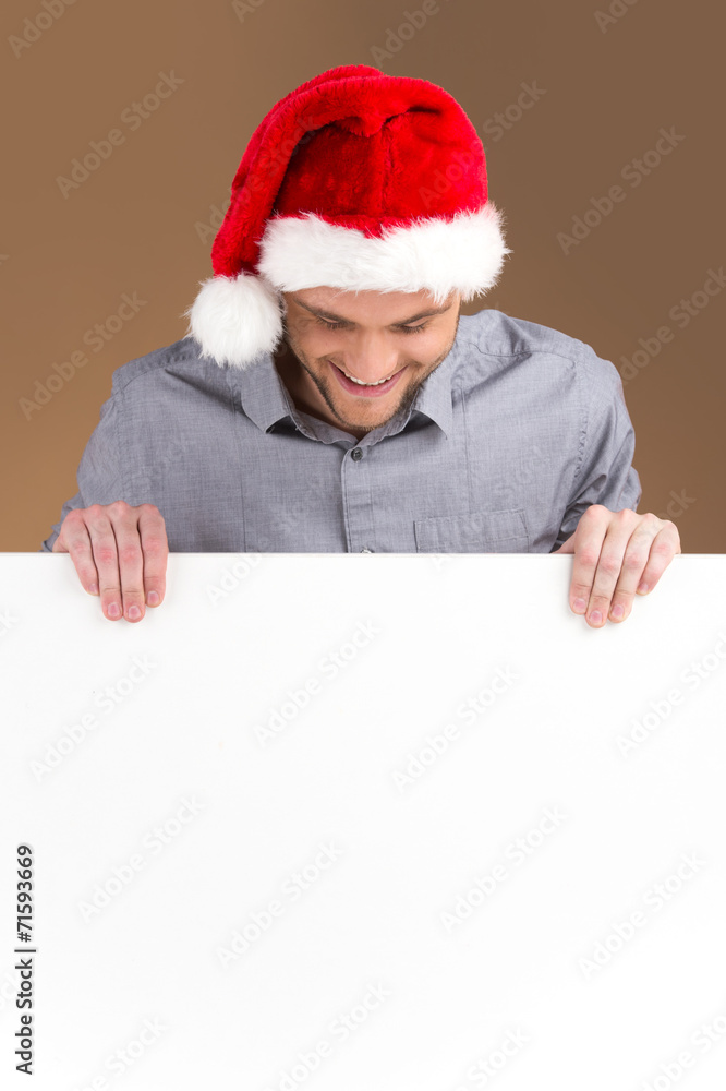 young man looking down on blank panel isolated young man looking down on blank panel isolated