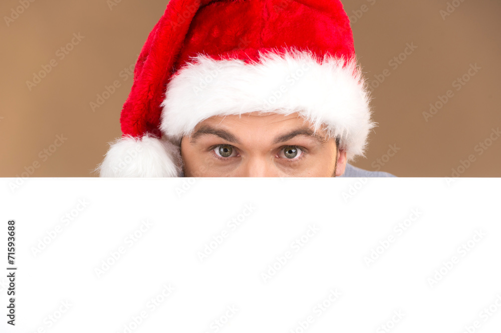 young man looking into camera with blank panel isolated young man looking into camera with blank panel isolated