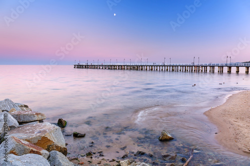 Baltic pier in Gdynia Orlowo at sunset, Poland #71594810