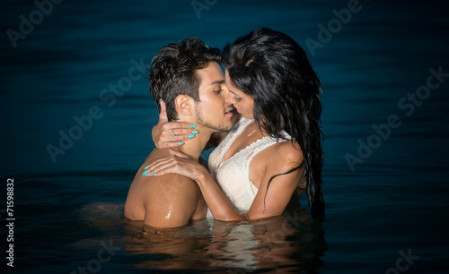 Passionate young couple in water