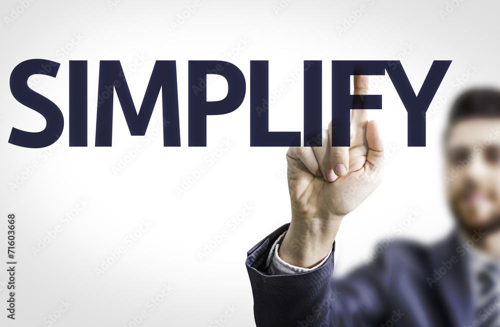 Business man pointing to transparent board with text: Simplify