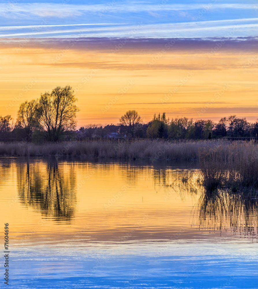 Fototapeta premium sunset in Zinnowitz with reflection on the water