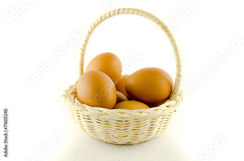 EGGS in basket on white backgound