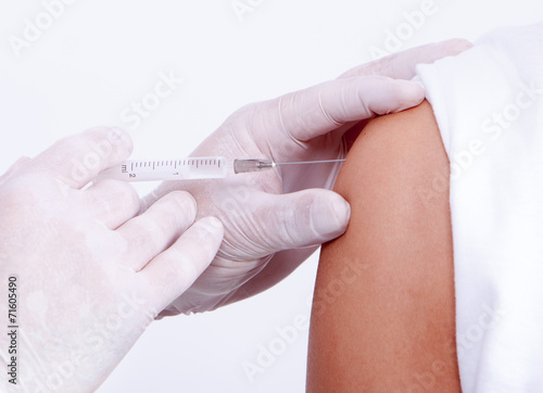 Nurse giving a vaccine for a patient