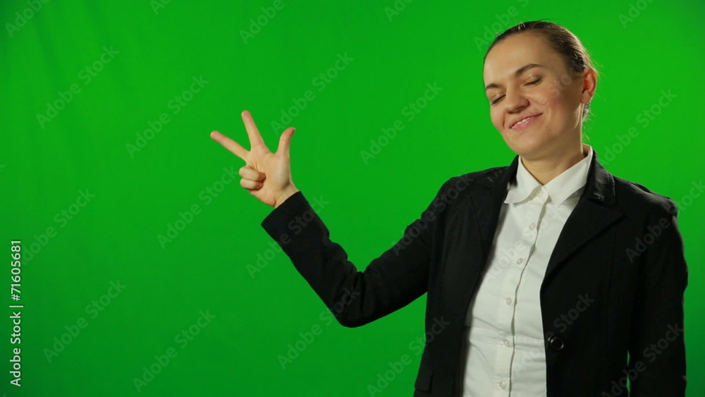 Brunette businesswoman countdown on a green screen. Brunette businesswoman countdown on a green screen.