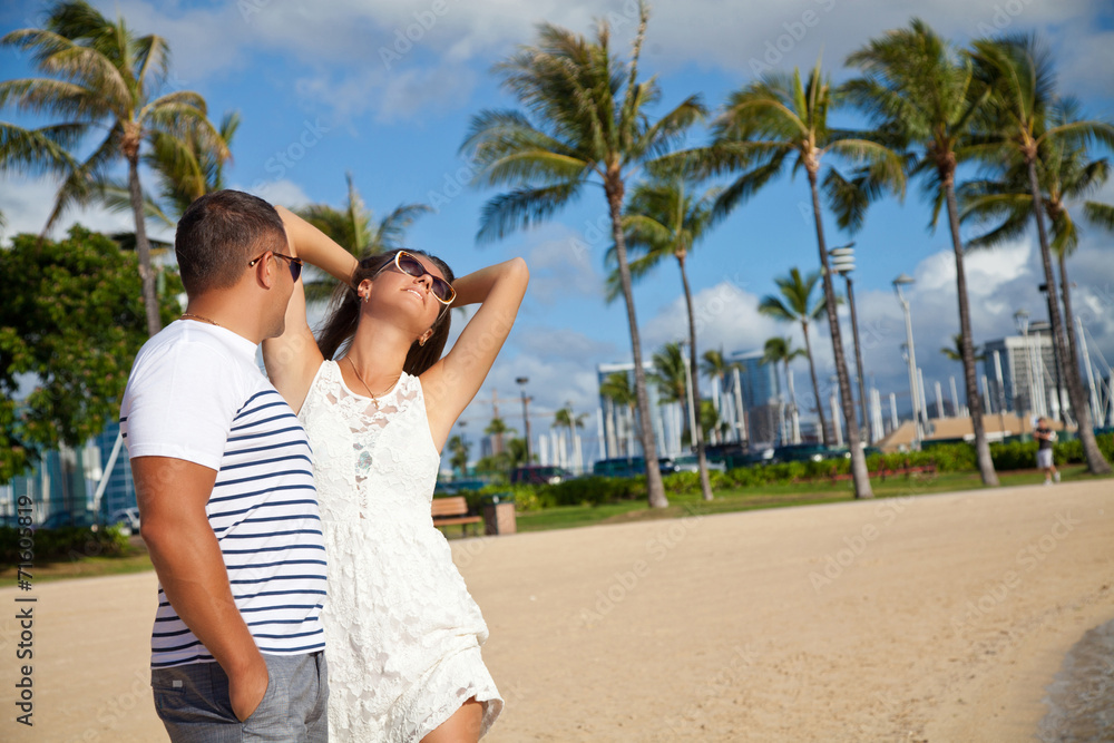 Woman and man smiling happy on beach on Hawaii Woman and man smiling happy on beach on Hawaii