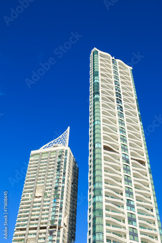 Two skyscrapers and blue sky