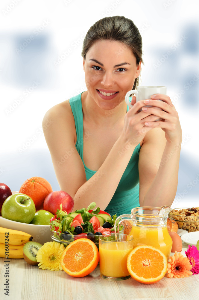 Young woman having breakfast. Balanced diet Young woman having breakfast. Balanced diet