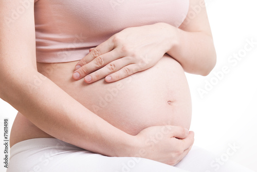 Beautiful belly of young attractive pregnant woman 