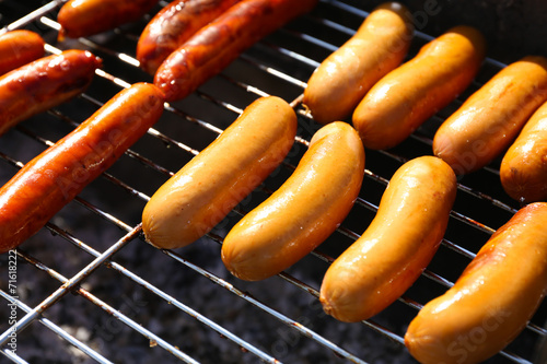 Sausages on barbecue grill, close-up