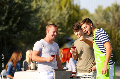 Young friends having barbec...